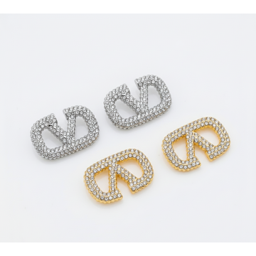 Λαμπερά Σκουλαρίκια με σχήμα 'V' και στράς